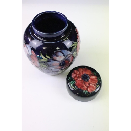 26 - Two Moorcroft pottery blue ground floral ginger jars to include a Hibiscus pattern and Anemone patte... 