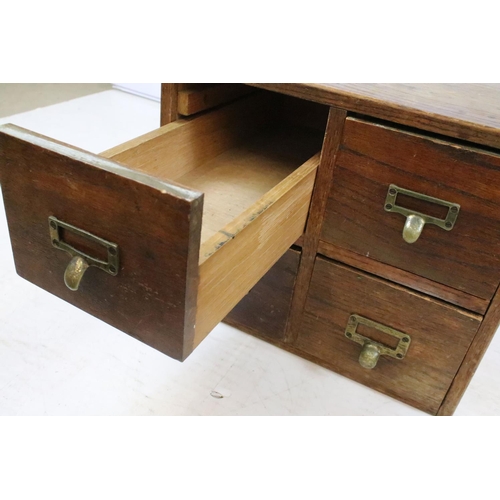 260 - Early 20th century oak chest of four small office drawers, 30.5cm high x 38cm wide x 49cm deep