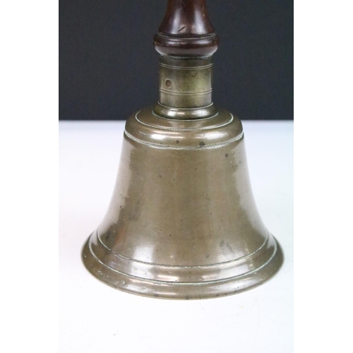 266 - Brass bell with turned wooden handle, approx 10