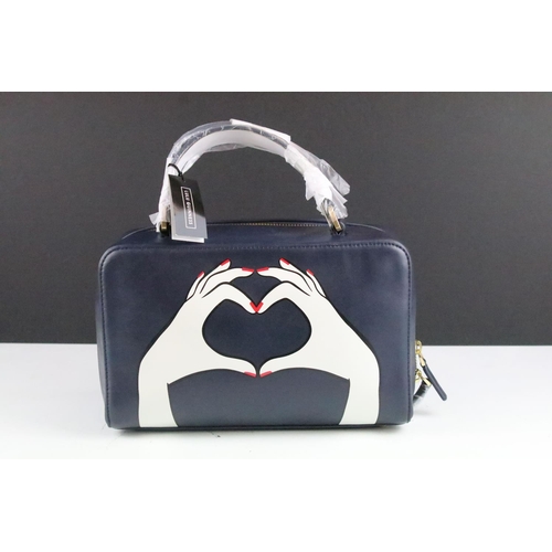 271 - Lulu Guinness handbag depicting two hands forming a heart, with twin carry handles and central zip, ... 