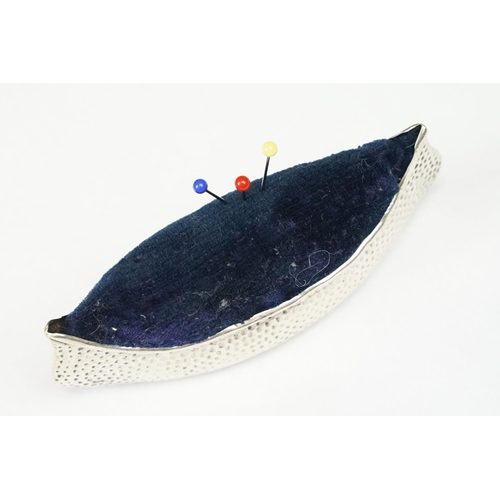 290 - An early 20th century fully hallmarked sterling silver pin cushion in the form of a canoe, makers ma... 