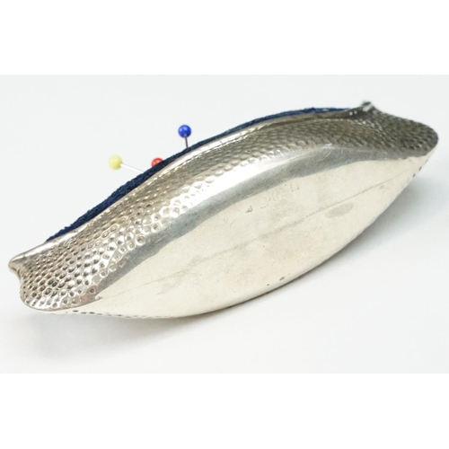 290 - An early 20th century fully hallmarked sterling silver pin cushion in the form of a canoe, makers ma... 