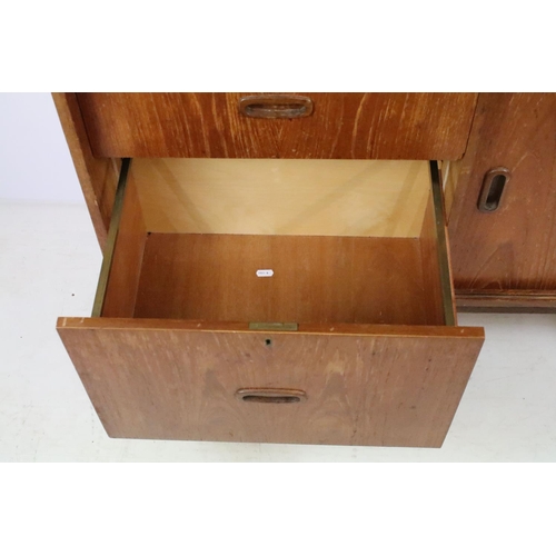 336 - Mid 20th C teak bureau with fold down door and fitted interior, twin drawer with sliding cupboard, 1... 