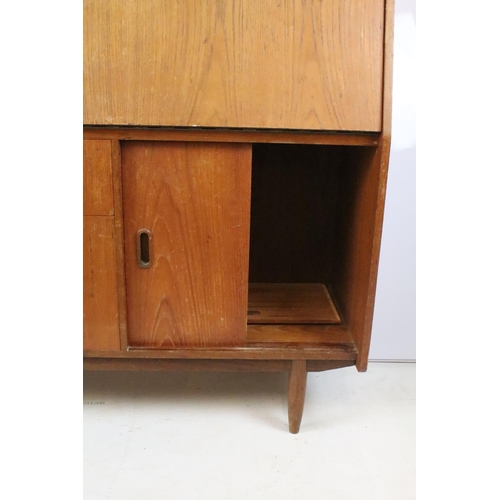 336 - Mid 20th C teak bureau with fold down door and fitted interior, twin drawer with sliding cupboard, 1... 