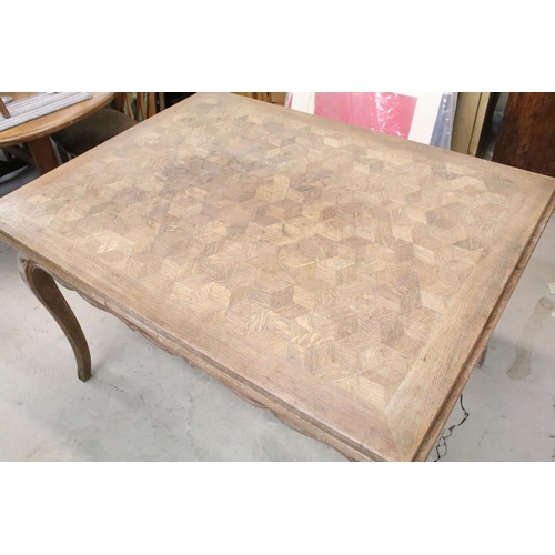 345 - Continental style oak draw leaf, extending dining table, with parquetry design, shaped apron on carv... 