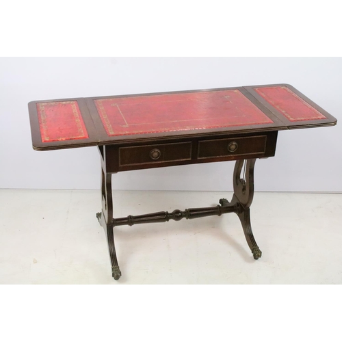 352 - Mahogany drop flap coffee table, with red leatherette inset top on lyre end supports, 56cm high x 10... 