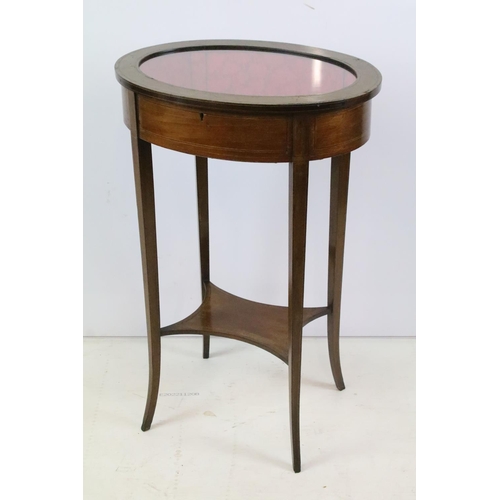 357 - Edwardian mahogany inlaid oval bijouterie table, with glazed top above stretchered panel, 75.5cm hig... 