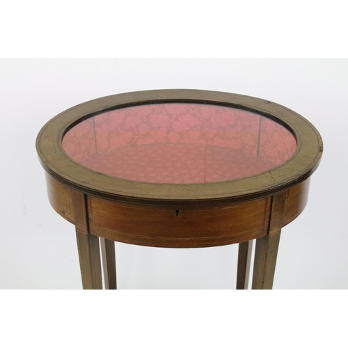 357 - Edwardian mahogany inlaid oval bijouterie table, with glazed top above stretchered panel, 75.5cm hig... 