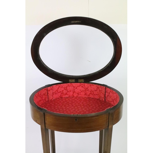 357 - Edwardian mahogany inlaid oval bijouterie table, with glazed top above stretchered panel, 75.5cm hig... 