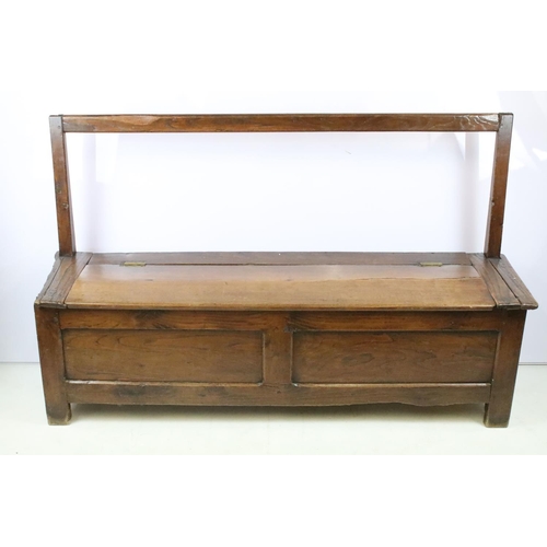 359 - 19th century oak bench / settle, the seat lids to reveal storage, with panelled front, 94cm high x 1... 