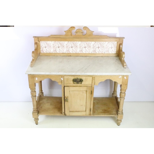 361 - Victorian pine washstand, with carved pediment and tiled back and marble top above single drawer and... 