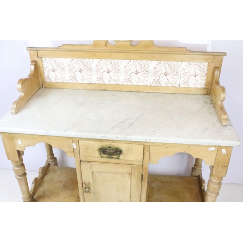 361 - Victorian pine washstand, with carved pediment and tiled back and marble top above single drawer and... 