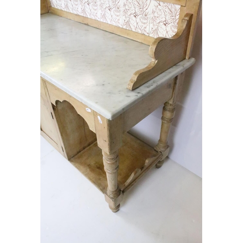 361 - Victorian pine washstand, with carved pediment and tiled back and marble top above single drawer and... 