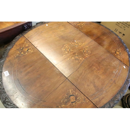 363 - Victorian walnut breakfast table, with marquetry inlay within carved borders on elaborately carved f... 