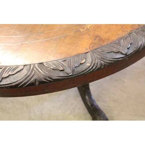 363 - Victorian walnut breakfast table, with marquetry inlay within carved borders on elaborately carved f... 