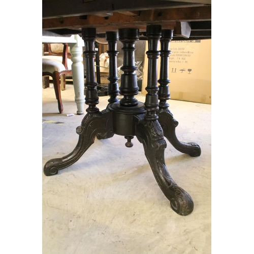 363 - Victorian walnut breakfast table, with marquetry inlay within carved borders on elaborately carved f... 