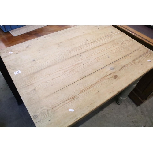 365 - Early 20th century pine kitchen table, on turned tapering legs, 74.5cm high x 107cm wide x 75cm deep