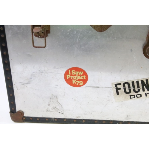 366 - Vintage metal travel trunk with souvenir stickers to the sides and lids and metal locks with black b... 