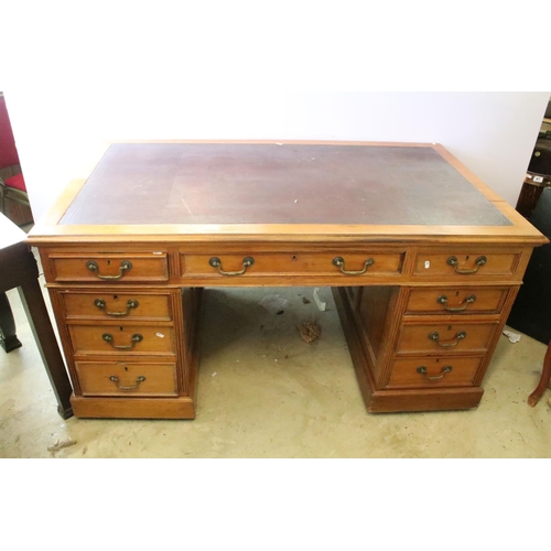 368 - Early 20th century mahogany twin pedestal desk with leatherette inset top, above an arrangement of n... 