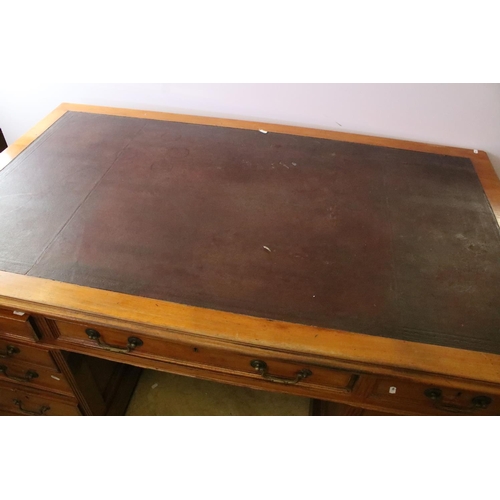 368 - Early 20th century mahogany twin pedestal desk with leatherette inset top, above an arrangement of n... 