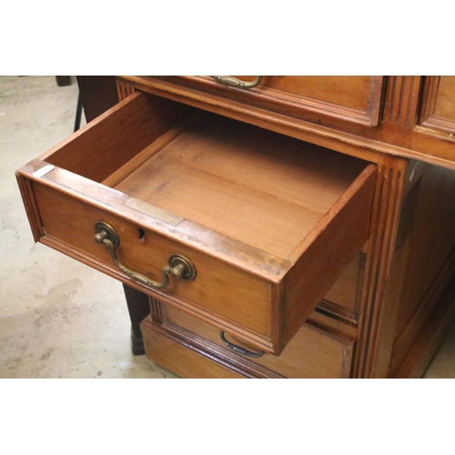 368 - Early 20th century mahogany twin pedestal desk with leatherette inset top, above an arrangement of n... 