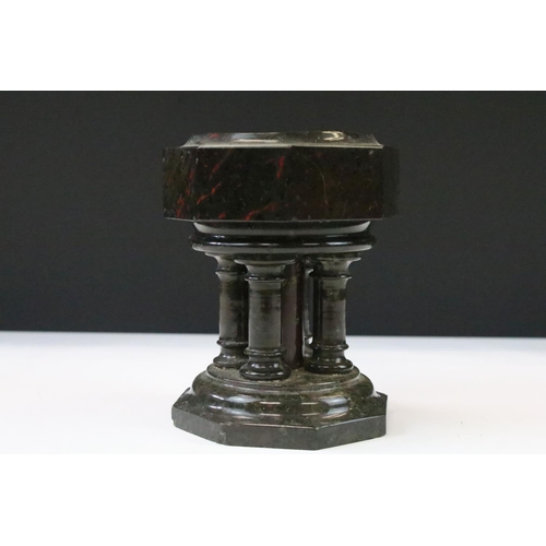 37 - Polished granite dish raised upon five column supports and an octagonal base, approx 14cm tall