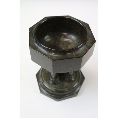 37 - Polished granite dish raised upon five column supports and an octagonal base, approx 14cm tall