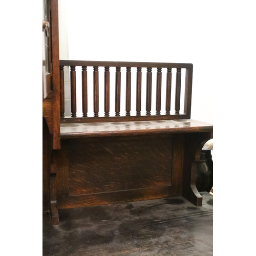 370 - Early 20th century oak sideboard, with lead glazed cupboard and shelves above central drawer, flanke... 