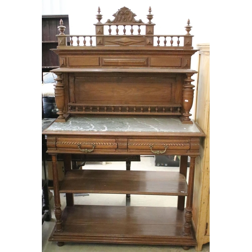 371 - Early 20th century carved oak sideboard, with carved pediment, galleried shelf and marble top, above... 