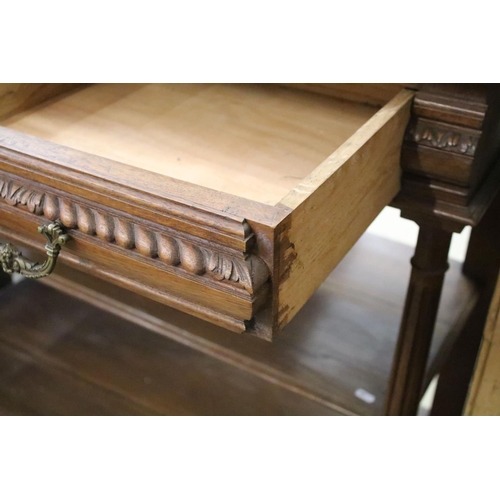 371 - Early 20th century carved oak sideboard, with carved pediment, galleried shelf and marble top, above... 