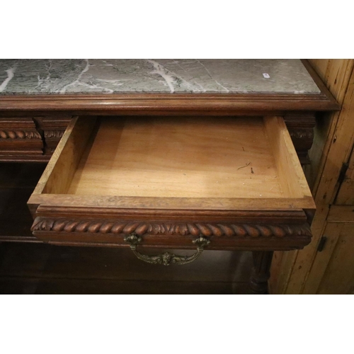 371 - Early 20th century carved oak sideboard, with carved pediment, galleried shelf and marble top, above... 