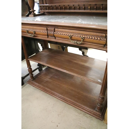 371 - Early 20th century carved oak sideboard, with carved pediment, galleried shelf and marble top, above... 