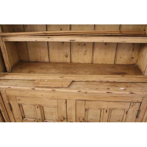 373 - 19th Century stripped pine Irish dresser with 3 x shelves and two doors to base, 75