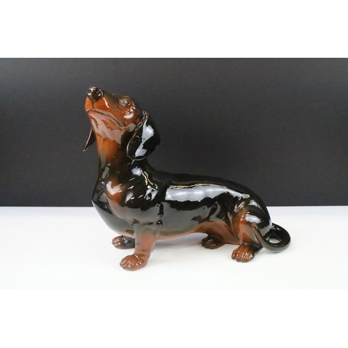 39 - Large Beswick Dachshund ceramic figure in black with brown finish, marked to base, 13.5