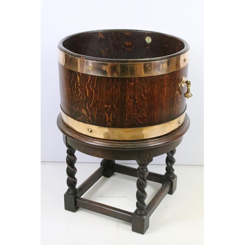 47 - Early 20th century oak coopered barrel with liner, on carved oak stand, maker's label for R.A.Lister... 