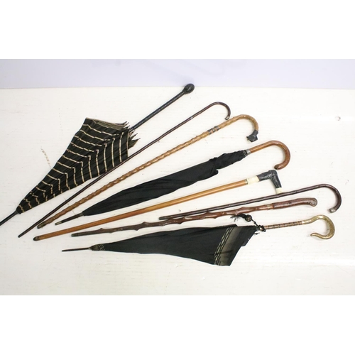 50 - Group of vintage / antique walking sticks and umbrellas to include a 'knobbly' walking stick with si... 