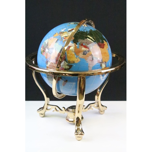 51 - Gemstone globe raised on a brass lacquered stand with inset compass to base, approx 47cm tall