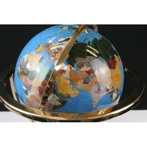 51 - Gemstone globe raised on a brass lacquered stand with inset compass to base, approx 47cm tall