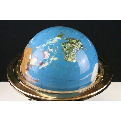 51 - Gemstone globe raised on a brass lacquered stand with inset compass to base, approx 47cm tall