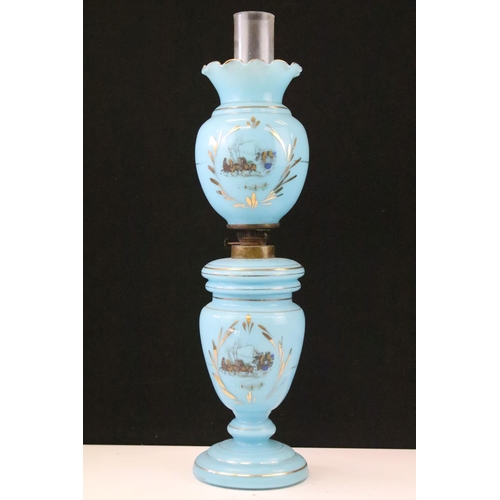 52 - 19th century blue glass oil lamp decorated with horse & cart scenes, with gilt details, complete wit... 