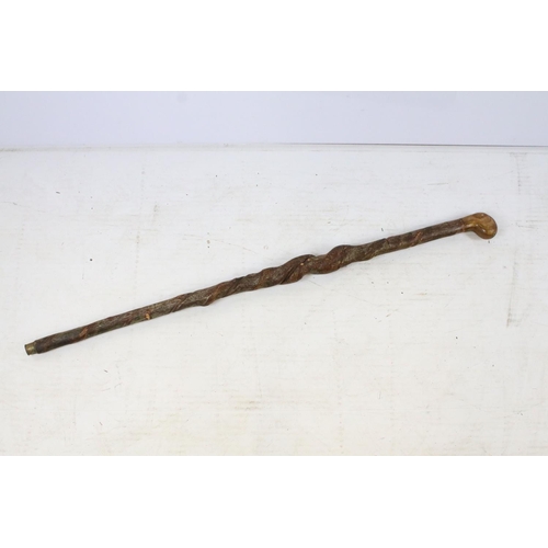 55 - Vintage wooden walking stick of spiralling form, approx 102cm long