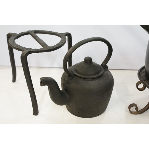 281 - A collection of vintage cast iron kitchen implements to include saucepan with lid, two kettles, caul... 