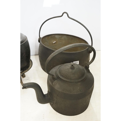 281 - A collection of vintage cast iron kitchen implements to include saucepan with lid, two kettles, caul... 