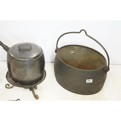 281 - A collection of vintage cast iron kitchen implements to include saucepan with lid, two kettles, caul... 