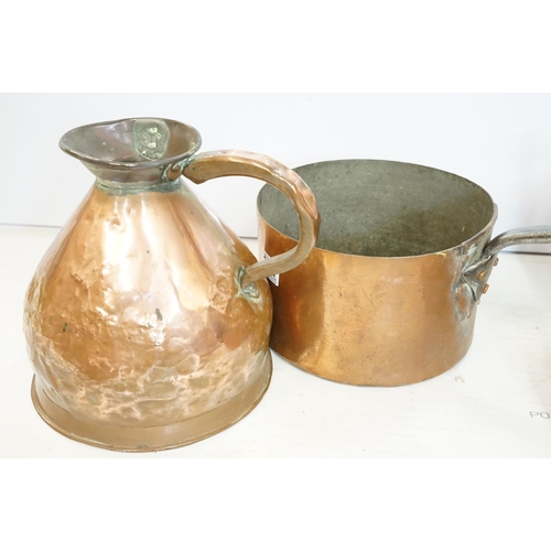 282 - A collection of mixed copper ware to include kettle, saucepan, ladles, jug...etc.