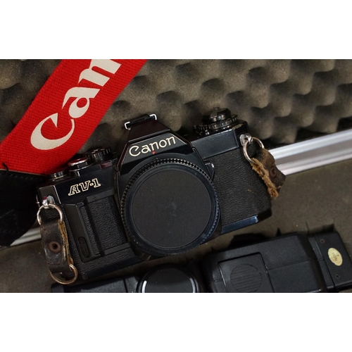 284 - A collection of mixed photogrpahic equipment to include Canon AV1 35mm SLR camera with lenses and ac... 