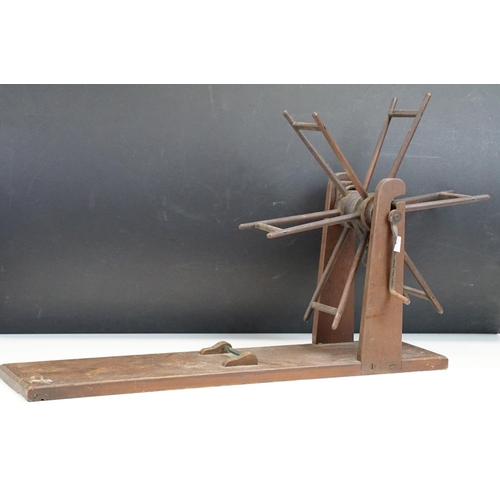 285 - A antique wooden wool winder together with a small collection of vintage fishing tackle to include a... 