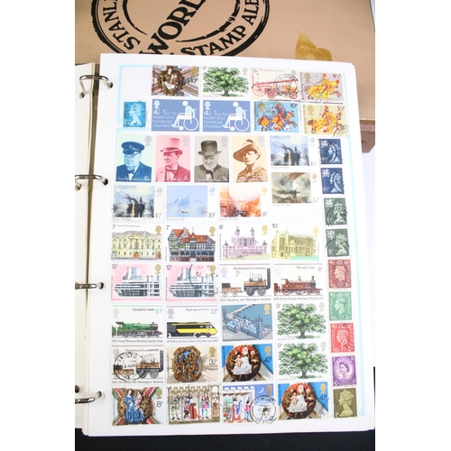 203 - A collection of mixed stamps within albums to include British, World and Commonwealth examples toget... 