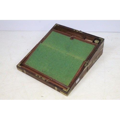 295 - A mahogany brass banded writing slope with fitted interior together with another writing slope.