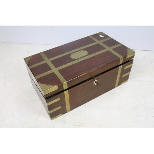 295 - A mahogany brass banded writing slope with fitted interior together with another writing slope.